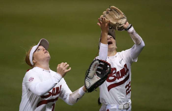 Mar 20, 2023; Tuscaloosa, AL, USA; Alabama utility player Emma Broadfoot (12) and Alabama infielder Kali Heivilin (22) drift back for a fly ball in shallow right field during Alabama s 2-1 loss in extra innings to Arkansas. The Tide dropped two out of three games to the Razorbacks.